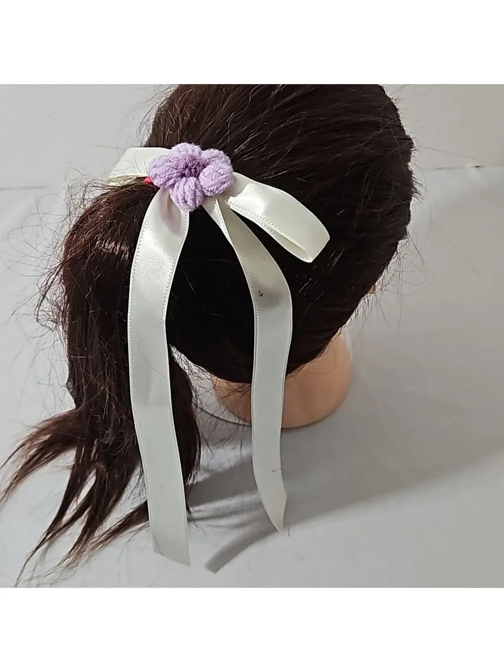 Hand Crafted Ivory Bow with Purple Crochet Flower